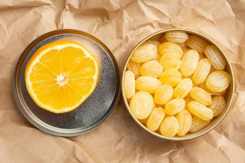 Lemon candy in an iron box Stock Photos