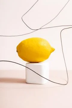 Lemon cube wire isolated beige Stock Photos