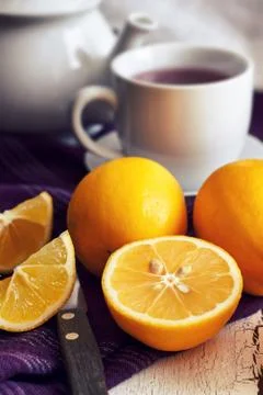 Lemon with cup of tea Stock Photos