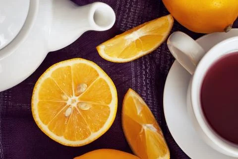 Lemon with cup of tea Stock Photos