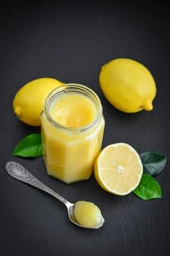 Lemon curd in jar Stock Photos