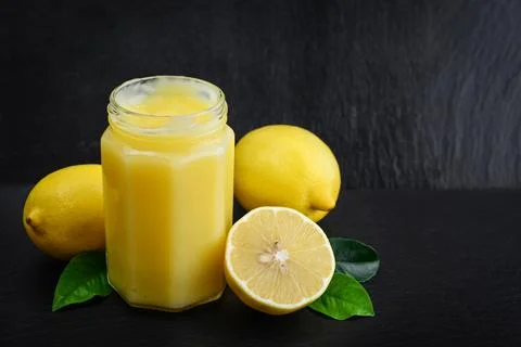 Lemon curd in jar Stock Photos