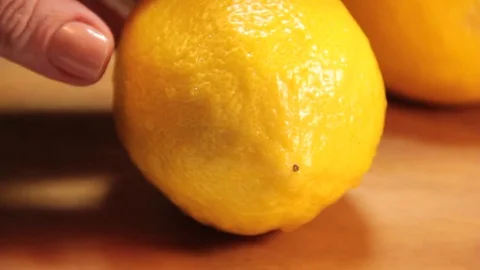 Lemon cut chopping board Stock Footage 76989050