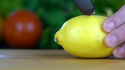 Lemon is cut with a knife Stock-Footage 85227182