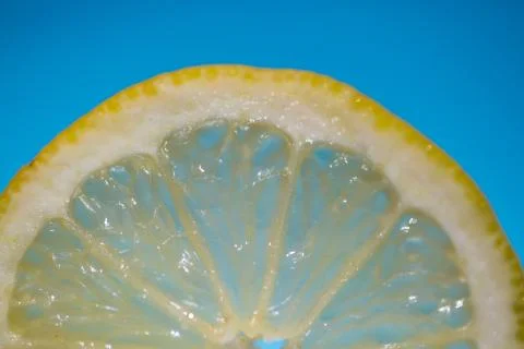 Lemon cut open, blue background Stock Photos