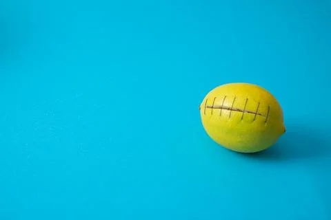 Lemon cut with stitches Stock Photos