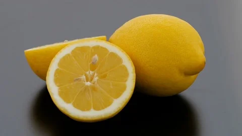 Lemon Cut on Turntable - Black Background Stock Footage 75855202