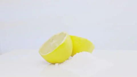 Lemon Cutted By Halves Rotating With Pile Of Salt 스톡 동영상 108796538