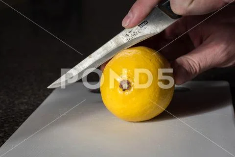 Lemon on Cutting Board Stock Photos
