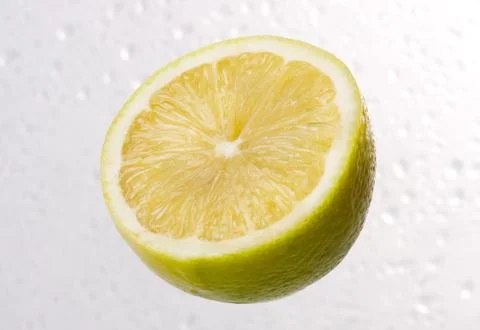 Lemon on dewy background Stock Photos