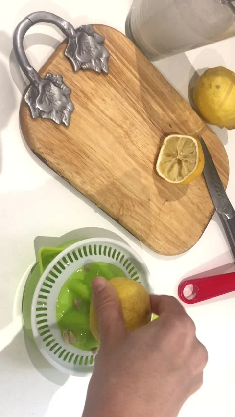Lemon Drink Preparation In Kitchen Fresh Citrus Beverage Vertical Close-Up Stock-Footage 331944018