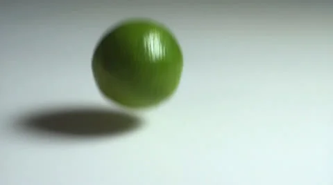 Lemon dropping down in slow motion Stock Footage 24737994