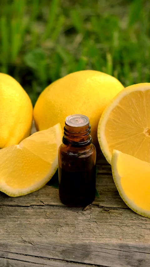 Lemon essential oil in a bottle. Selective focus. Stock Footage 313125190