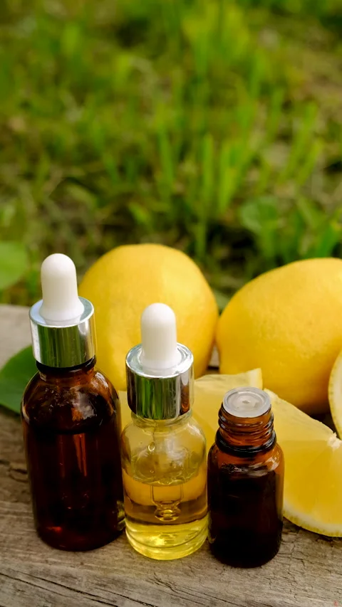 Lemon essential oil in a bottle. Selective focus. Stock Footage 313125258