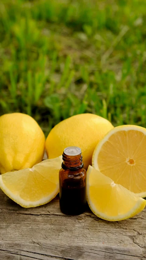 Lemon essential oil in a bottle. Selective focus. Stock Footage 313661827