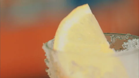 Lemon falling into a glass with ice Stock Footage 52183568