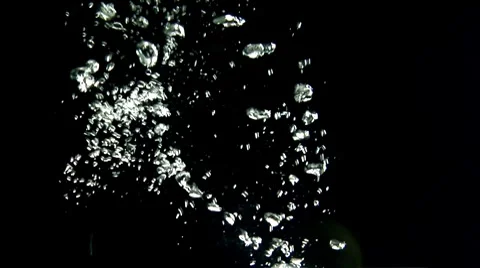 A lemon falling into water (black background) Stock Footage 8573827