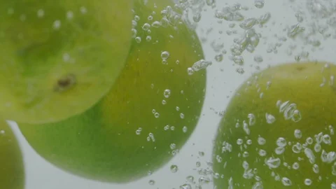 Lemon falling in water Stock Footage 98300217