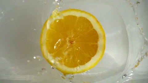 Lemon falling into the water. Slow motion. Stock Footage 127090808
