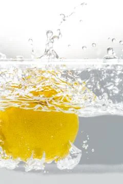 Lemon Falling into Water Splash Stock Photos