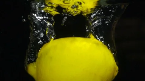 Lemon falls into the water, slow motion Stock Footage 85142153