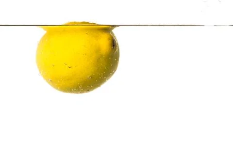 Lemon floating on water white background Stock Photos
