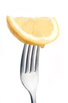 Lemon on fork Stock Photos