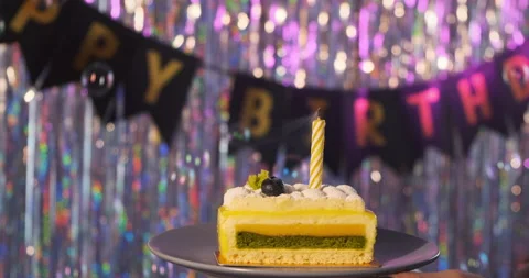 Lemon fruit cream cake. Blowing candle happy birthday sign text shiny background Stock Footage 149826342