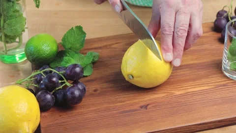 Lemon fruit cutting on the board for the lemonade or cocktail, close up view Stock Footage 158861467
