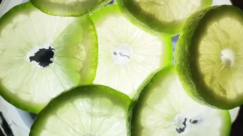 Lemon Fruit light macro shot, lemon fruit macro showcasing half green lemons Video stock 295846467