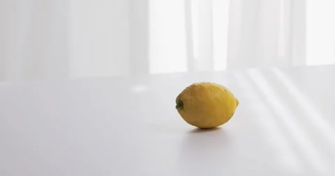 Lemon fruits on white table in the kitchen against window Stock Footage 330941487