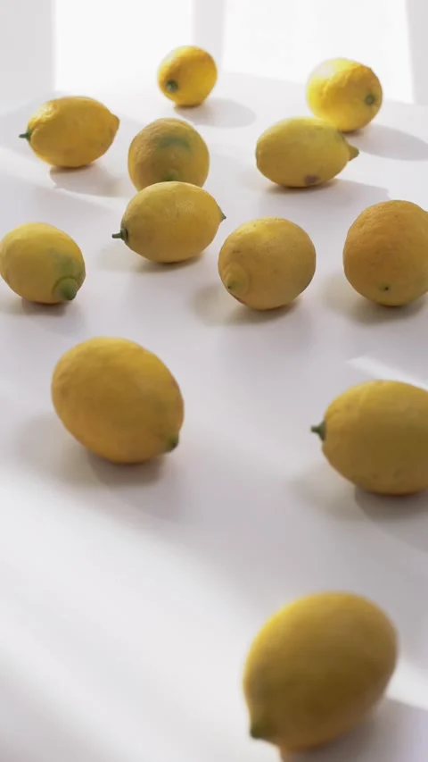 Lemon fruits on white table in the kitchen against window Stock Footage 330941698