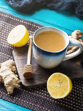 Lemon ginger hot tea drink with honey as natural remedy Stock Photos