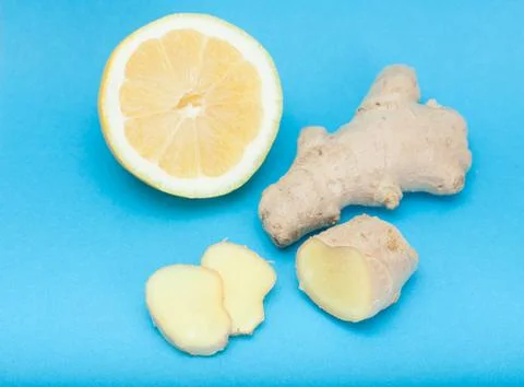 Lemon with ginger slices Stock Photos