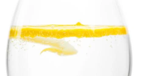 Lemon in glass Stock Photos