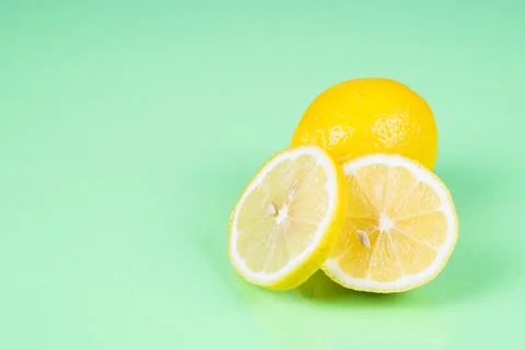 Lemon on green background Stock Photos