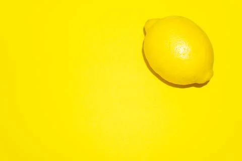 Lemon isolated on yellow background. Foto stock