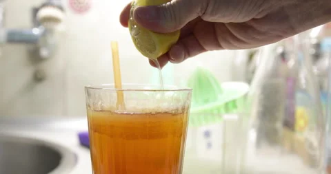 Lemon juice, squeezing lemon half, close-up Stock Footage 231562245