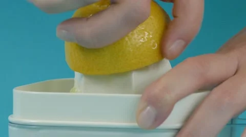 Lemon juicing and squeezing close up, 4k Stock Footage 60777276