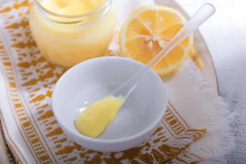 Lemon kurd with a spoon Stock Photos