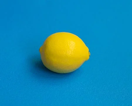Lemon. The lemon on blue background Stock Photos