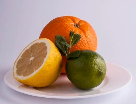 Lemon, lime and orange Stock Photos