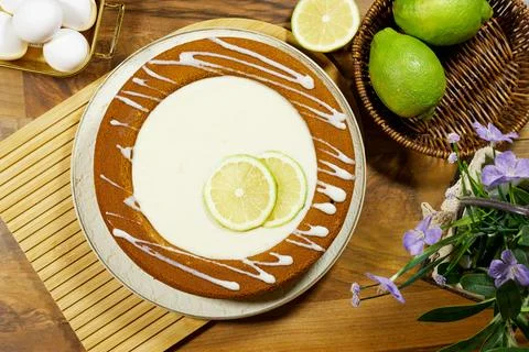 Lemon Lime Bundt Cake With Icing Drizzle, Fresh Citrus Slices and Rustic Kitchen Stock Photos