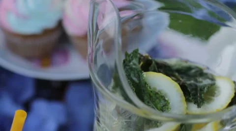 Lemon, lime. Freshness. White table with sweets on nature. Wedding cakes and flo Stock Footage 61715194