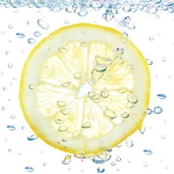Lemon in a liquid with bubbles. On a white background. 스톡 사진