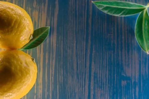 Lemon lying on a wooden table Stock Photos