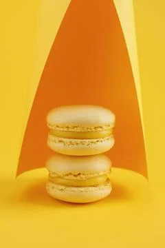 Lemon macaroons on a yellow background Stock Photos
