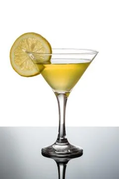 Lemon martini with lemon slice Stock Photos