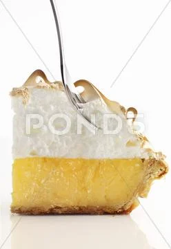 Lemon meringue pie with a fork Stock Photos