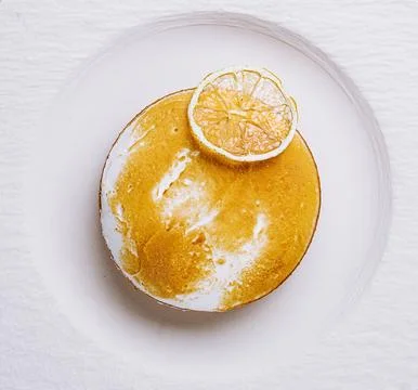 Lemon mousse served with lemon slice Stock Photos